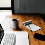 Person working on a laptop at a desk, building an online income through affiliate marketing