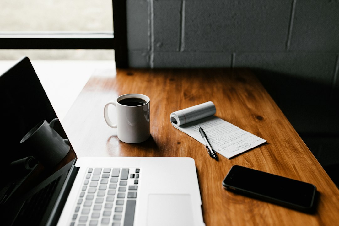 Person working on a laptop at a desk, building an online income through affiliate marketing